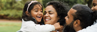 Happy Indian family having fun outdoors.